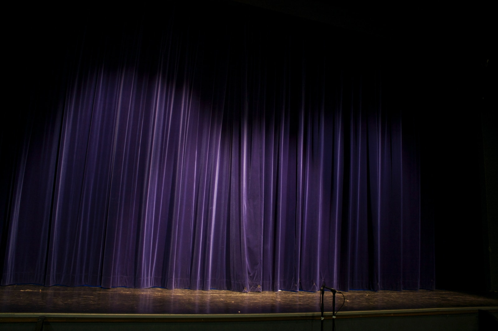 purple curtain on window during daytime